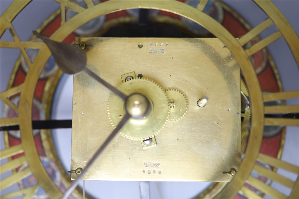 A brass skeleton wall timepiece stamped Bell Bros. Bristol